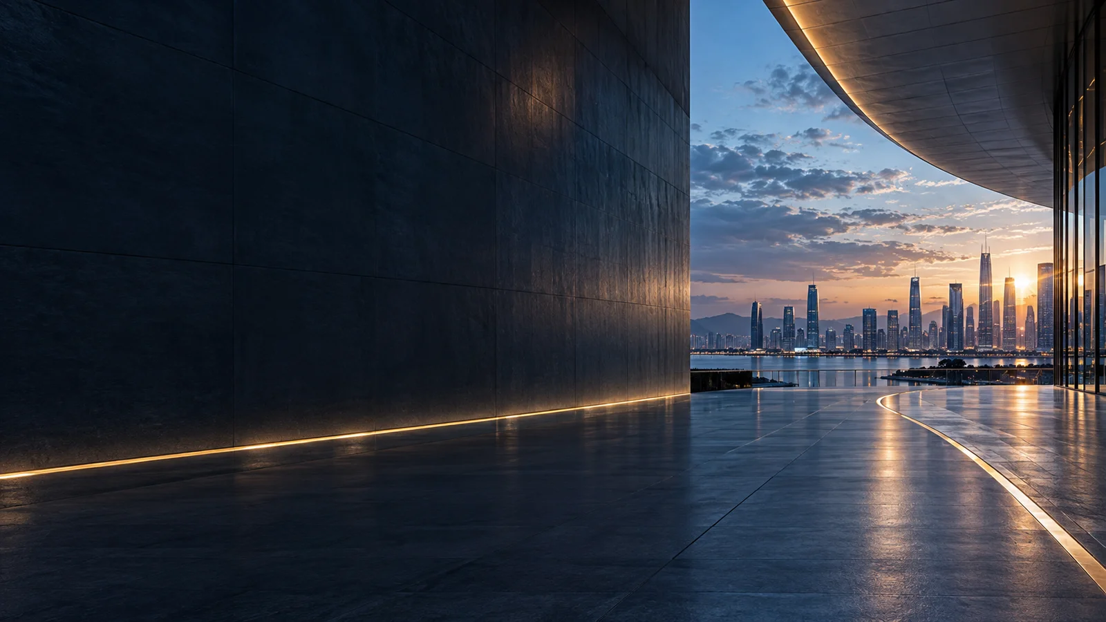 Glass architecture reflecting the light of a city at dusk